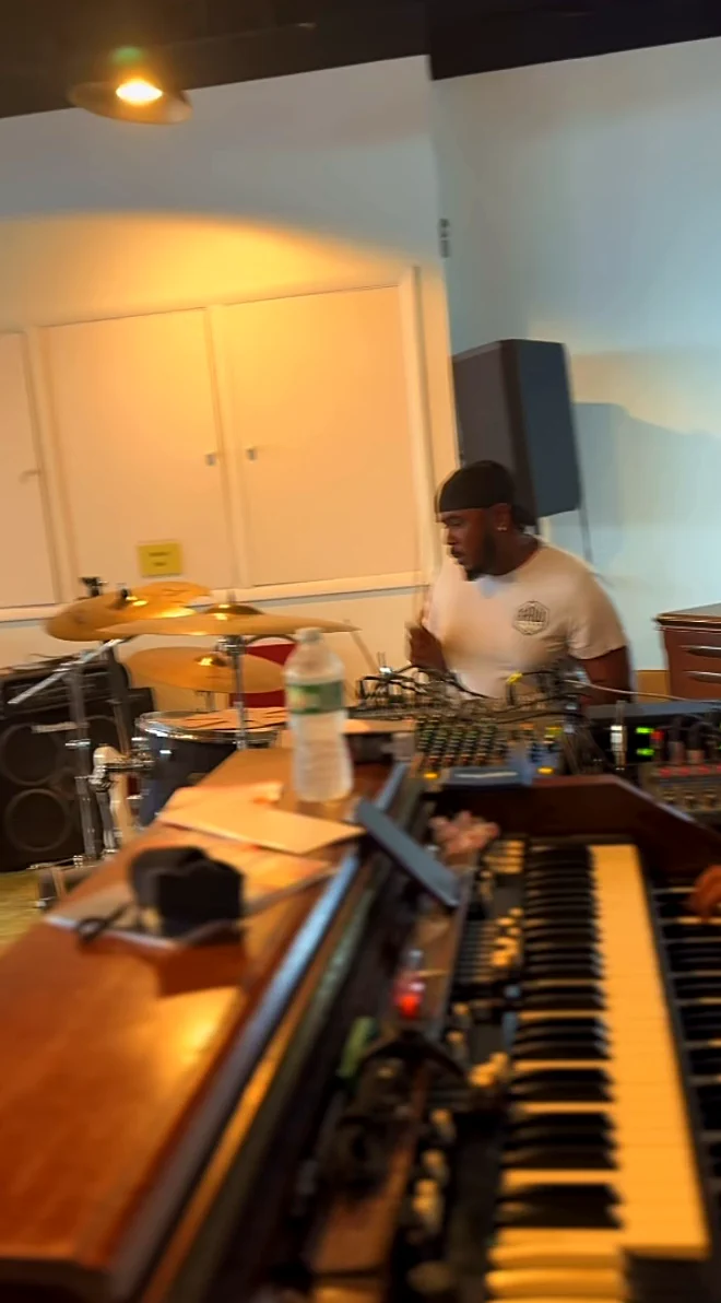 The organist at the Hammond organ with the drummer behind